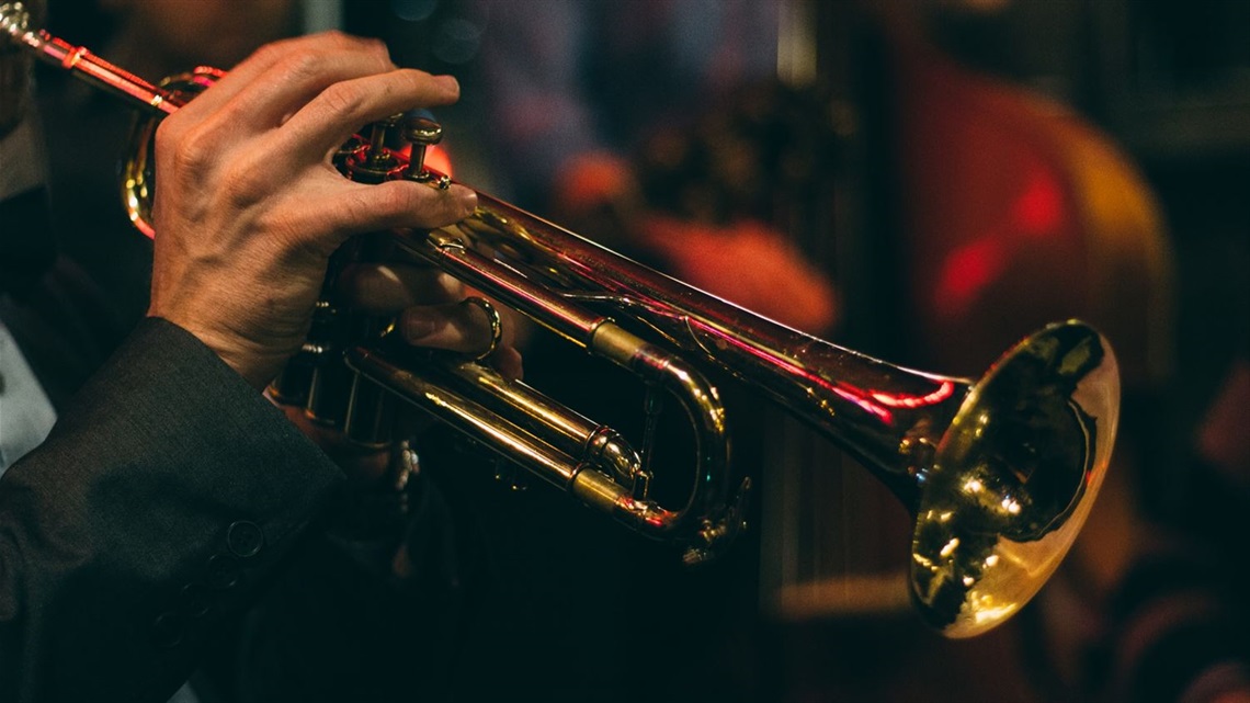 Photo of hand playing trumpet