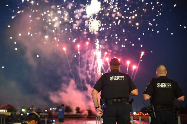 two police officers watching fire works